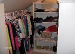 Shelves with hanger bar in attic area